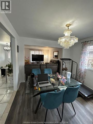 Windsor other for rent - A living room with a glass table and blue chairs.