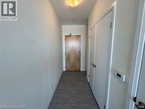 Kitchener condo for rent - A room with a white door and a white closet.