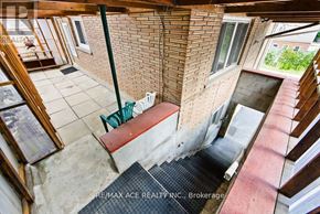 Hamilton (Ainslie Wood) multi-family for rent - A balcony with a brick wall and a concrete floor.