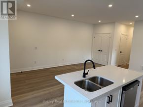Collingwood townhouse for rent - A kitchen with a sink and a countertop.
