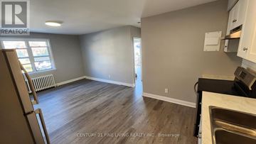Toronto (Caledonia-Fairbank) multi-family for rent - A kitchen area with a dishwasher and a window.