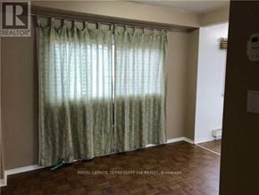 Toronto (Scarborough Village) house for rent - A room with a curtain and a wooden floor.