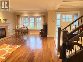 Vancouver house for rent - A living room with a fireplace and a piano.