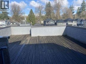 Vancouver house for rent - A living room with a fireplace and a flat screen TV.