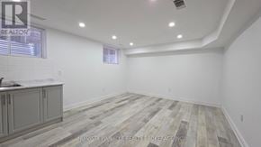 London North (North C) house for rent - A room with wooden flooring and white walls.