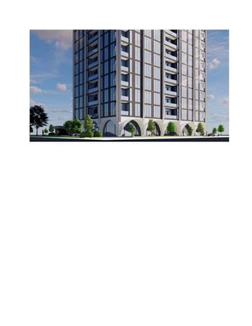 Calgary apartment for rent - A tall building with many windows and balconies is surrounded by trees.