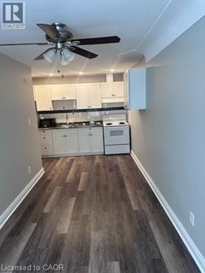 Hamilton apartment for rent - A kitchen with white cabinets and a wood floor.