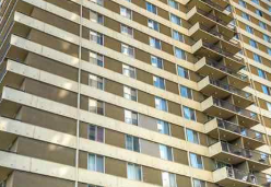 Edmonton apartment for rent - A tall building with many windows and balconies.