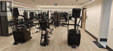 Toronto (Englemount-Lawrence) condo for rent - A gym with a variety of equipment including treadmills, weights, and exercise machines.
