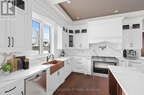 Ottawa house for rent - A modern kitchen with white cabinets and appliances.