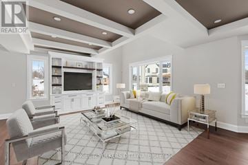 Ottawa house for rent - A modern living room with a glass coffee table and a white sofa.