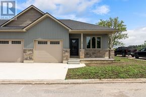 Huron East (Seaforth) townhouse for rent - A house with a grey roof and two garages is shown.