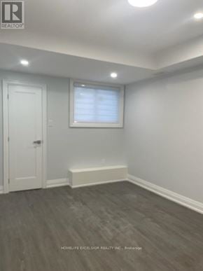 Toronto (Birchcliffe-Cliffside) house for rent - A room with a window covered in blinds and wooden flooring.