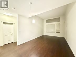 Vancouver apartment for rent - A room with wooden floors and white walls.