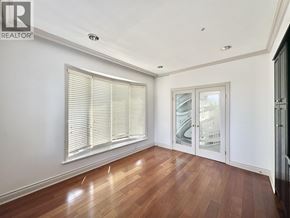 Vancouver house for rent - A room with wooden floors and a window with blinds.