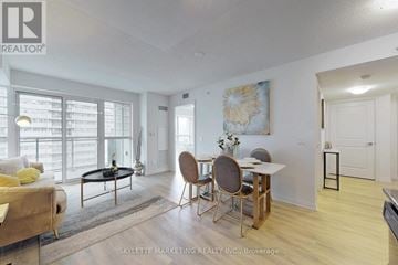 Toronto (Woburn) condo for rent - A living room with a dining table and chairs.