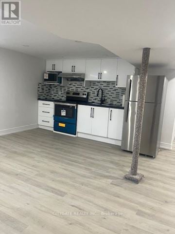 Toronto (Cliffcrest) house for rent - A kitchen with white cabinets and a blue drawer.