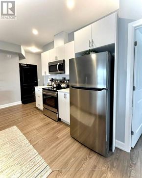 Ottawa condo for rent - A modern kitchen with a stainless steel refrigerator.