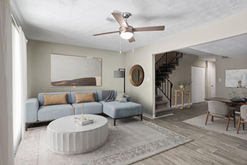Atlanta apartment for rent - A living room with a blue couch and a white coffee table.