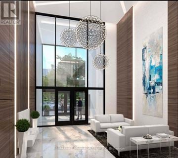 Hamilton (Central) condo for rent - A modern living room with a large chandelier and a painting on the wall.