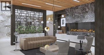 Windsor condo for rent - A modern living room with a large couch and a fireplace.