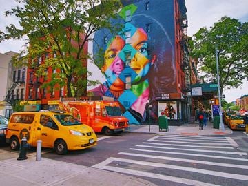 New York apartment for rent - a mural on the side of a building on a city street