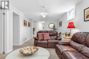 Mississauga (Mississauga Valleys) house for rent - A living room with brown leather couches and a white coffee table.