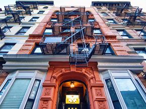 New York apartment for rent - a building with a fire escape on the side of it