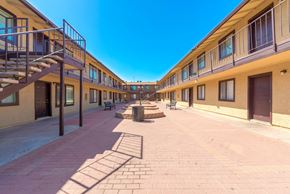 Phoenix apartment for rent - a courtyard between two buildings with benches and a staircase