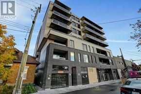 Ottawa condo for rent - A modern apartment building with a clear blue sky above.
