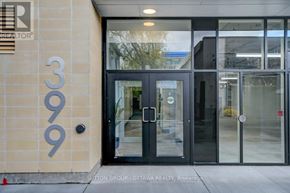 Ottawa condo for rent - The entrance to a building with a glass door and a number 309 on the wall.