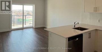 Kitchener condo for rent - A kitchen area with a sink and a window.
