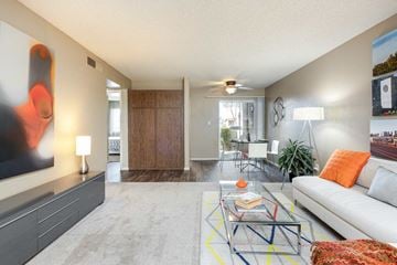 Phoenix apartment for rent - a living room with a white couch and a glass table