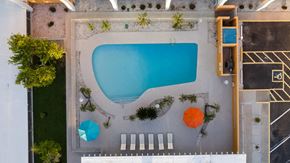 Phoenix apartment for rent - a birds eye view of a swimming pool with umbrellas