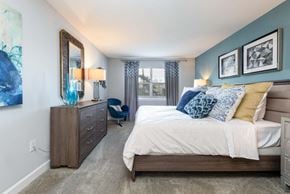Tampa townhouse for rent - a bedroom with a bed and a dresser
