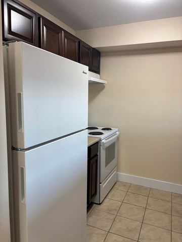 Dartmouth apartment for rent - A white refrigerator and stove in a kitchen.