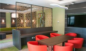 Hollywood apartment for rent - a dining room with a table and chairs and a television