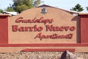 Guadalupe apartment for rent - a sign for a bario nuevo apartments in front of a building