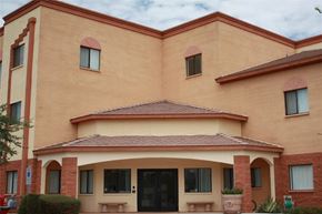 Phoenix apartment for rent - a building with two benches in front of it