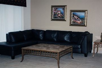 Phoenix apartment for rent - a living room with a black couch and a coffee table