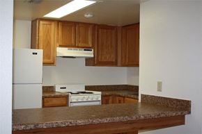 Tucson apartment for rent - a kitchen with a counter top and a refrigerator