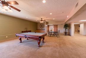 Tucson apartment for rent - a game room with a pool table in the middle of it