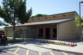 Phoenix apartment for rent - a building with a wheelchair parked outside of it
