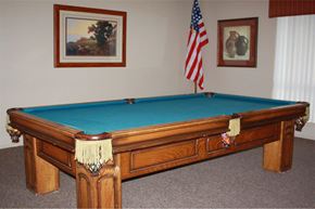 Phoenix apartment for rent - a pool table in a room with an flag