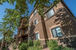 Guadalupe apartment for rent - a brick building with trees in front of it