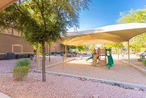 Guadalupe apartment for rent - a playground with a slide and trees in a park
