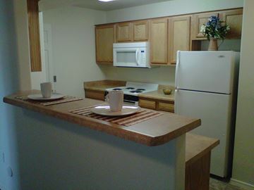 Guadalupe apartment for rent - a kitchen with a counter and a refrigerator
