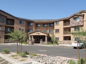 Guadalupe apartment for rent - an outside view of a large hotel building with a parking lot and a truck