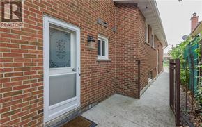 Brampton house for rent - A red brick house with a white door and a small porch.