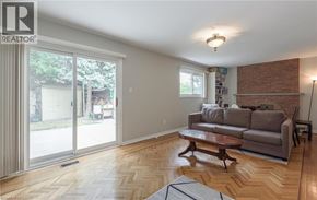 Brampton house for rent - A living room with a couch, coffee table, and sliding glass doors.